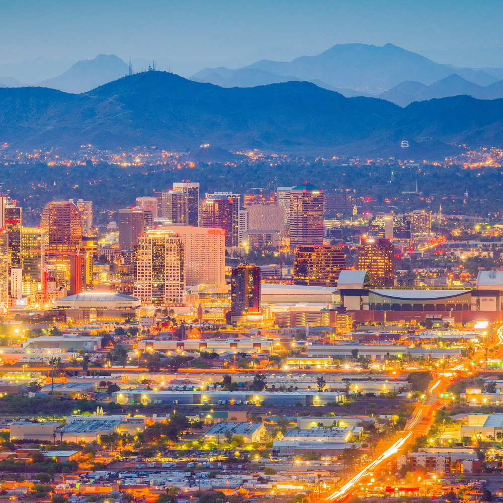 Aerial view of Phoenix, Arizona, showing the city's sprawling urban landscape and surrounding desert environment