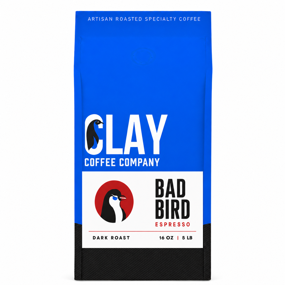 Bad Bird Espresso dark roast coffee bag with centered 4 by 2.6 inch penguin badge label on a pure white background